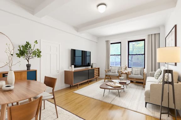 A living room with a wooden table and chairs, a television, and a couch.at Sutton Collection, New York New York