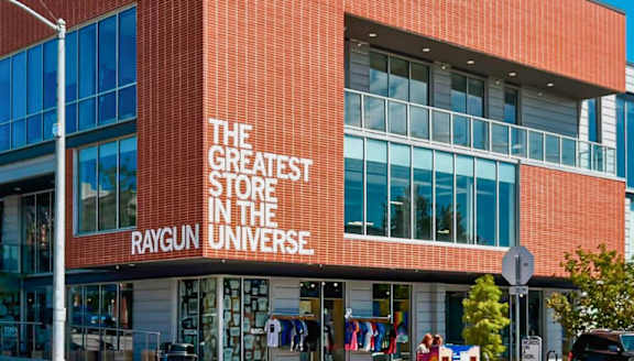 A storefront with a sign that says "The Greatest Store in the Universe Raygun".