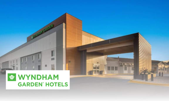 Wyndham Garden Hotel is a modern building with a spacious entrance.