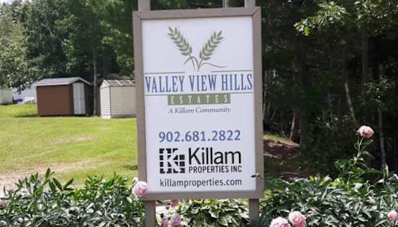 A sign for Valley View Hills Estates with a phone number and website for Killam Properties Inc.