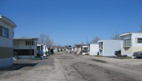 A row of houses with a clear blue sky above.