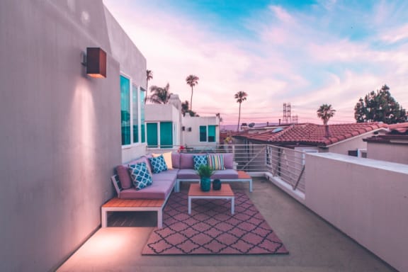 a large terrace with couches and a coffee table