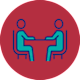 Two people sitting at a table.
