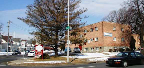 A sign in front of a building that says "Welcome to Maplewood".