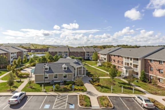 an aerial view of an apartment complex with cars in a parking lot at Rosemont Square in Randolph, Massachusetts 02368