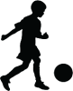 a silhouette of a boy kicking a soccer ball