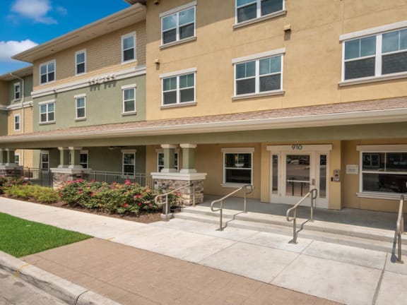 Front of apartment building with entrance and walkway, Wheatley Park Senior Living