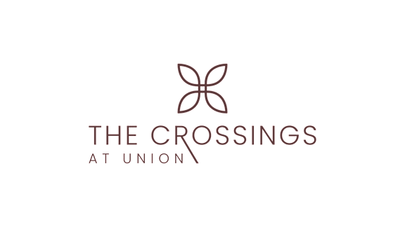 The logo for The Crossings at Union features a stylized butterfly.