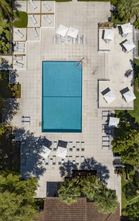 a birdseye view of a swimming pool on the side of a building with
