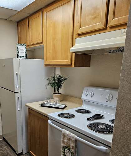 an overhead view of a kitchen with a stove and a refrigerator