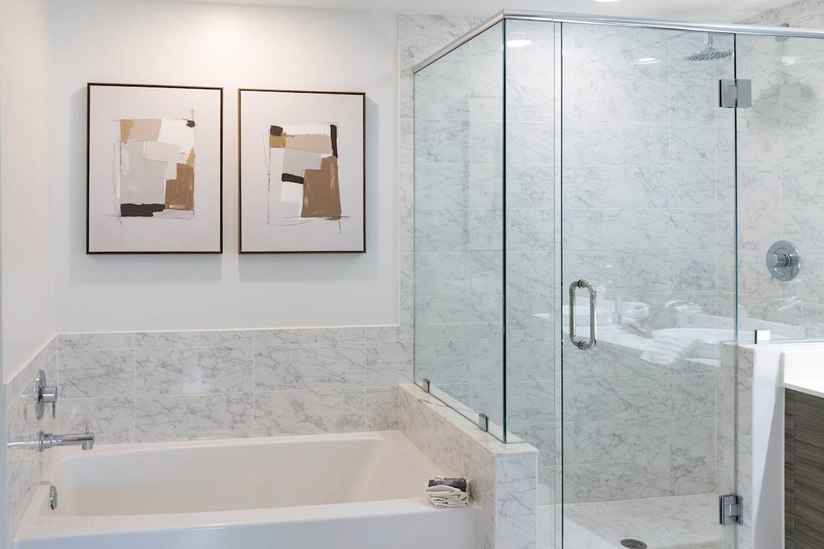 Bathroom with glass shower and soaking tub