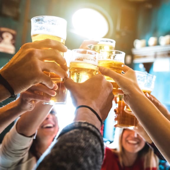 Group of Friends Out Having Drinks Making a Toast