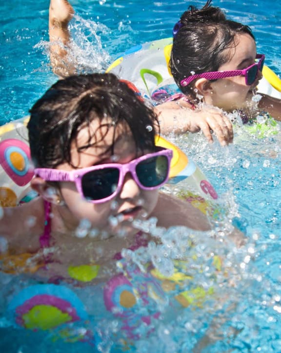 Kids Swimming in Pool at Deer Crest Apartments, Broomfield, 80020