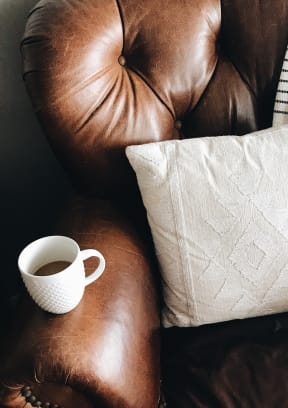 Armchair with Pillow and Coffee Mug