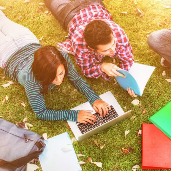 Group of Friends Outside Studying Together