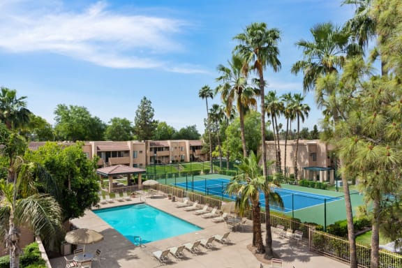 Pool, Pool Patio, Tennis Court & Exterior at Shorebird Apartments in Mesa, AZ