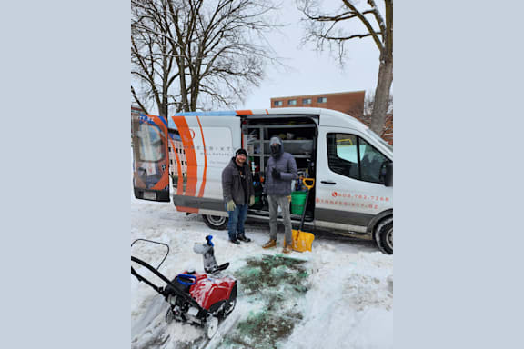 people are sitting on a bus in the snow