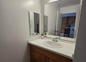 Thumbnail 16 of 22 - a bathroom with a sink and a washing machine