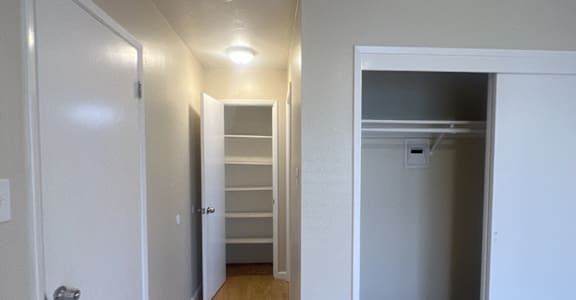 a kitchen with a white counter top and a cabinet