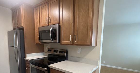 an overhead view of a kitchen with wooden cabinets