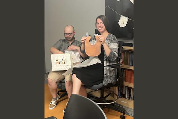 a man and a woman playing a game with a wii controller