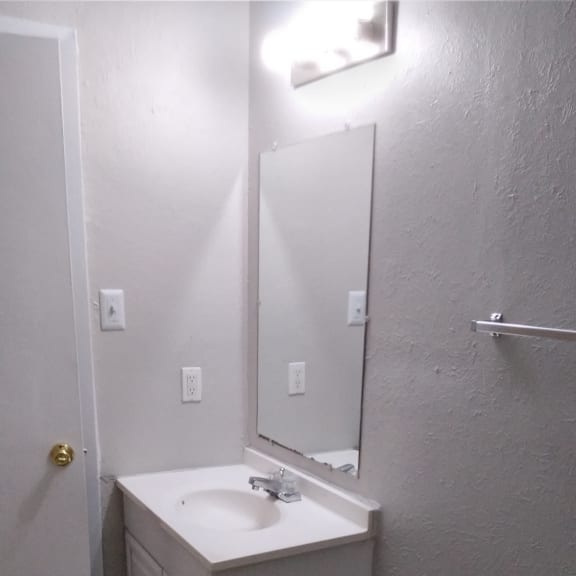 the bathroom has a urinal and a sink in it