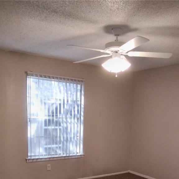 the view from the top of a room looking up at a window