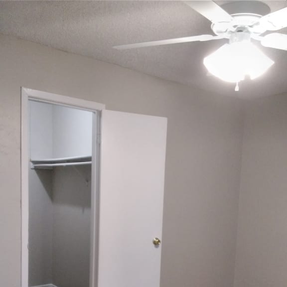 the top of the closet in the bathroom with the door open