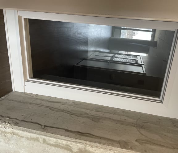 Window in the bedroom to allow beautiful natural light from the livingroom.