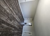 Thumbnail 10 of 17 - a view down the hallway from the top of the stairs looking down to the floor
