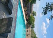 Thumbnail 8 of 20 - an aerial view of a pool and stairs with a blue sky in the background