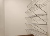 Thumbnail 18 of 18 - an empty room with metal bars hanging on the wall