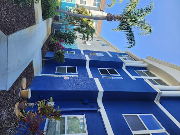 A blue and white striped awning over a building.