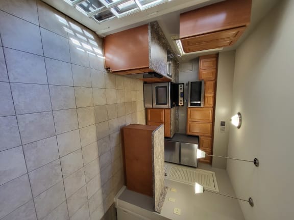 a view of the kitchen from the top of the stairs