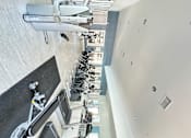 Thumbnail 2 of 44 - a view of ellipticals and treadmills in a spacious gym at The Bryant Apartments at Yorba Linda, Yorba Linda, 92887