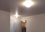 Thumbnail 15 of 41 - A white staircase with a light on the left side.