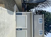 Thumbnail 4 of 48 - A house with a garage door opener attached to the wall.