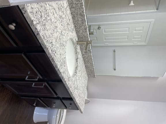 bathroom with granite countertop