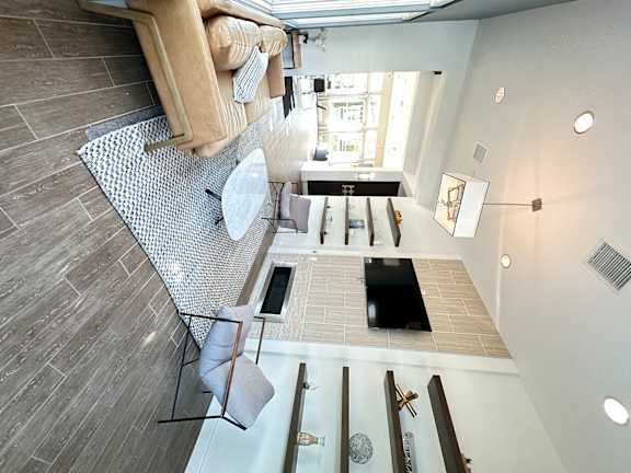 a club room with a couch and a tv in a loft at The Bryant Apartments at Yorba Linda, Yorba Linda, 92887