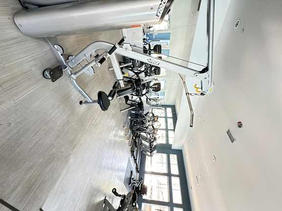 a row of weights machines in a gym at The Bryant Apartments at Yorba Linda, Yorba Linda California