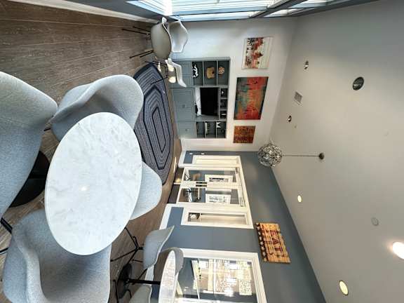a view from the top down of a living room with a table and chairs at The Bryant Apartments at Yorba Linda, Yorba Linda, CA 92887