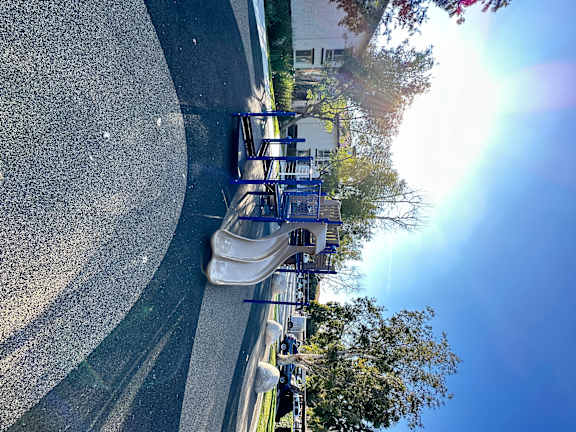 a park with multiple slides at The Bryant Apartments at Yorba Linda, California