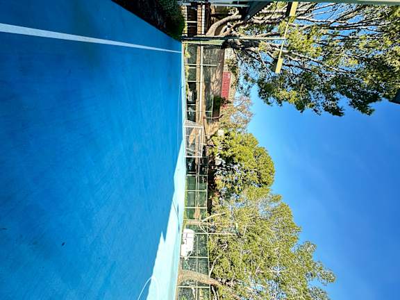 the sport court with soccer net and lush foliage at The Bryant Apartments at Yorba Linda, Yorba Linda California