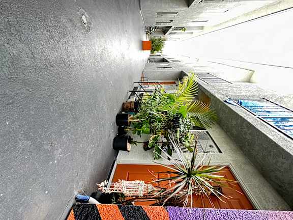 an overhead view of a building with plants in it at The Marq Apartments LLC, Los Angeles, California