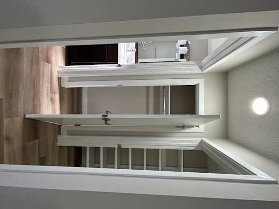 a kitchen with a sink and a mirror