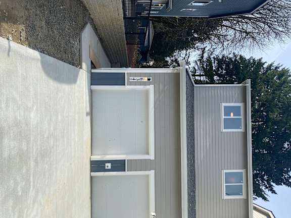 A house with a garage door opener attached to the wall.