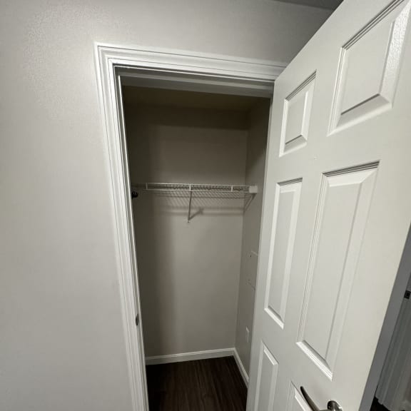 a small closet with a door at Carisbrooke at Manchester Apartments, Manchester, New Hampshire
