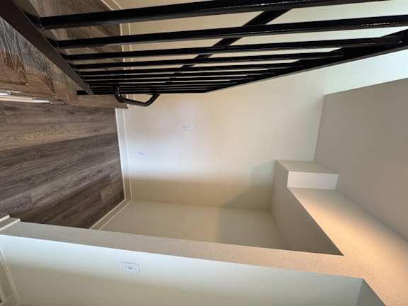 Corona, CA, Pet-Friendly Townhomes - Dos Lagos Townhomes - Open Living Area With Wood-Style Flooring, Neutral Walls, Recessed Lighting, and Large Windows.