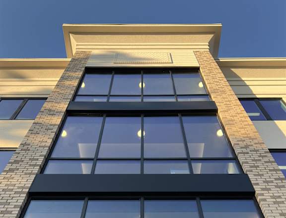 a close up of a building with windows and lights on it