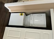 Thumbnail 36 of 48 - A white microwave oven is installed in a kitchen cabinet.